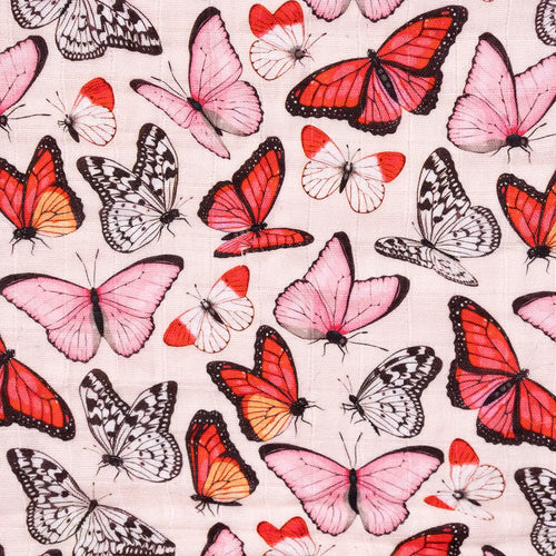 Close-up of Cynthia butterfly print on organic muslin fabric, vibrant pink butterflies hand-illustrated