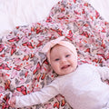 Cynthia butterfly print muslin baby swaddle blanket in vibrant pink, girls nursery